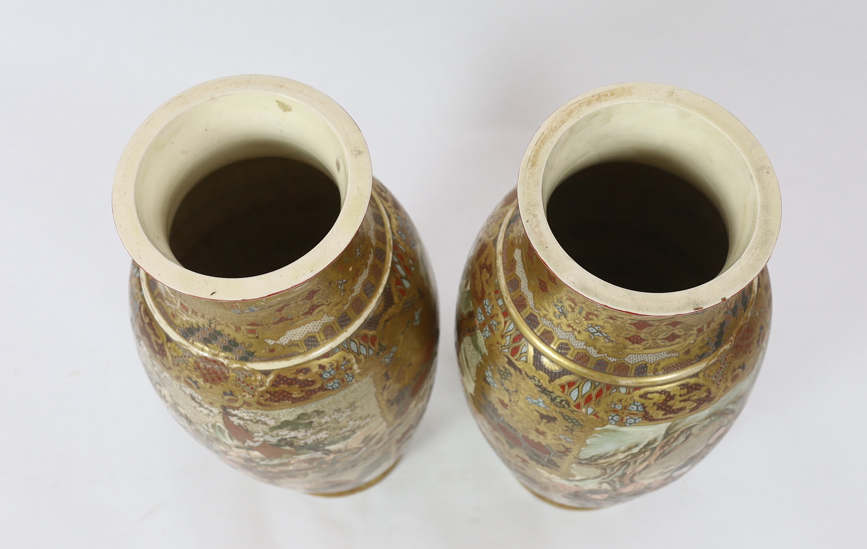 A pair of large Japanese Satsuma pottery 'Samurai' vases, Meiji period, one vase restored